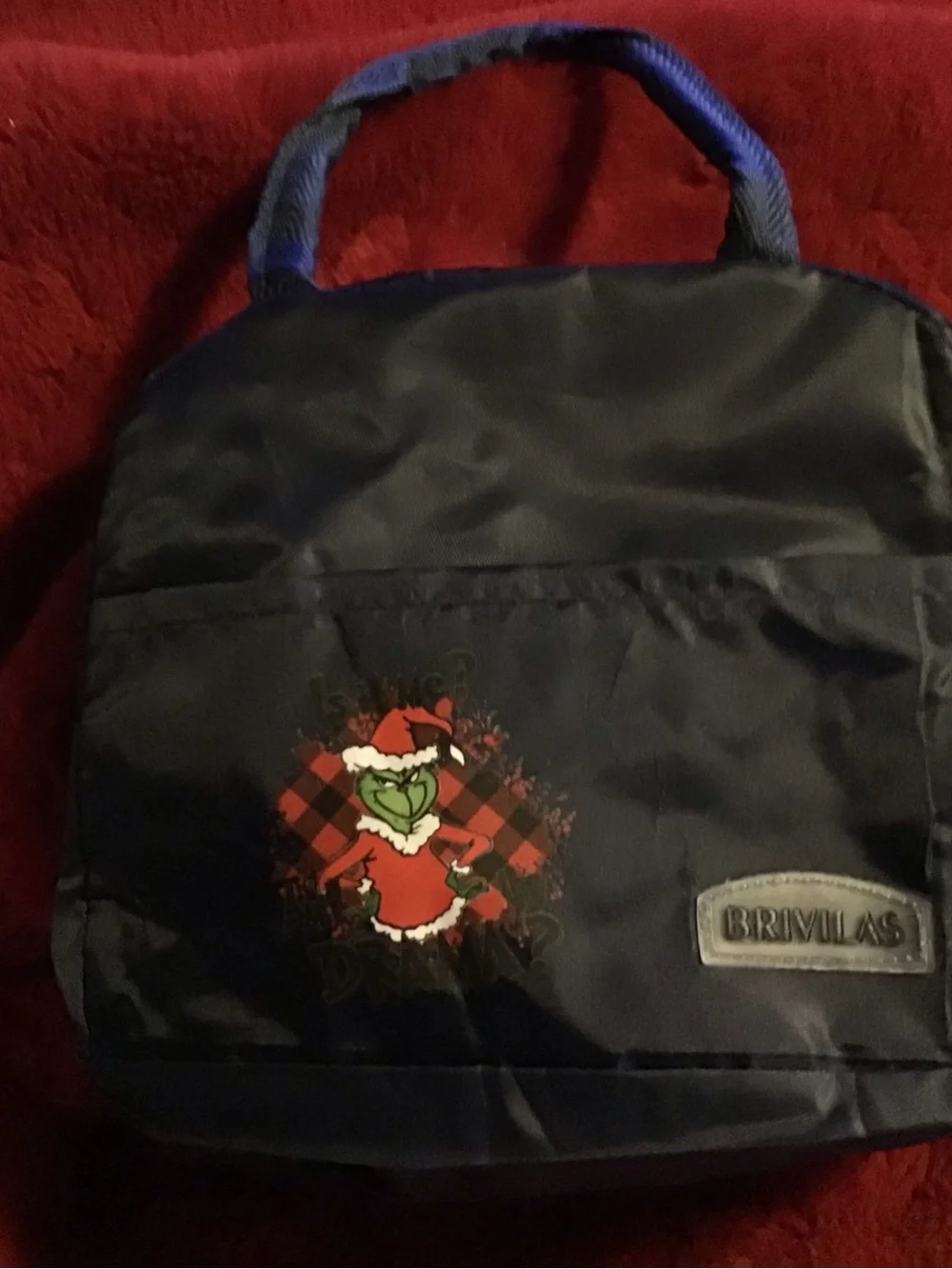Black insulated lunch bag with Grinch Holiday Graphic